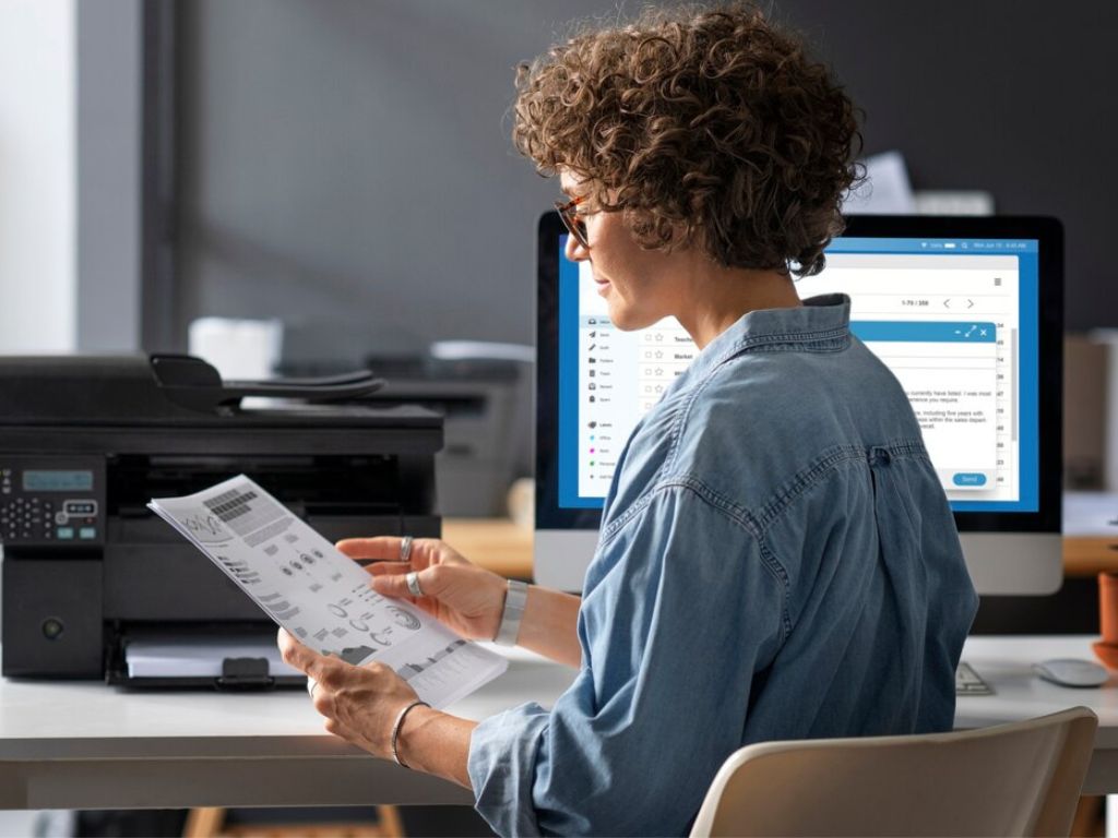 Friendly technician supporting a small-business print fleet